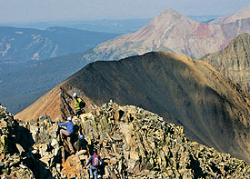 wilsonpk climb Erik Weihenmayer and our climbing party top a ridge on Wilson Peak. (Photo: Ryan Ross/TPL)